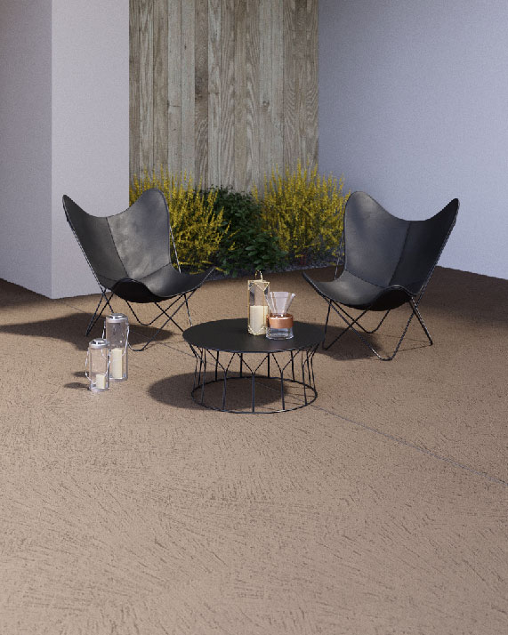 Effetto materico fiammato per la rasatura decorativa a base cementizia Rasico® su pavimentazione esterna